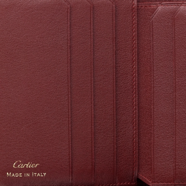 Must de Cartier vielseitige Brieftasche Bordeauxrotes Kalbsleder, Gold-Finish