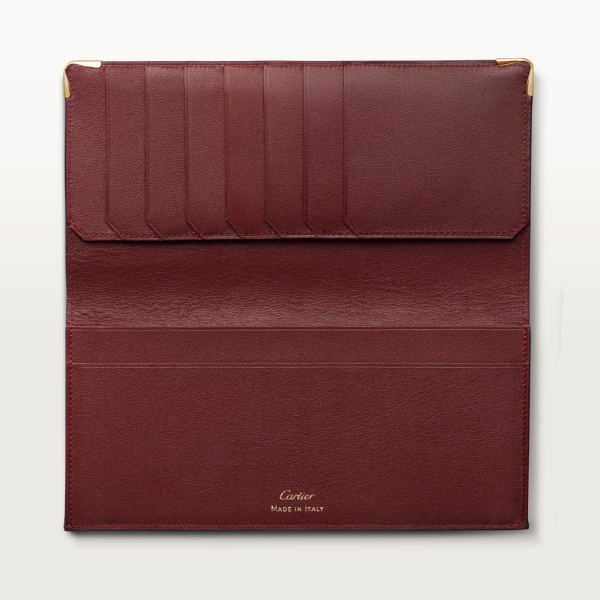 Must de Cartier Brieftasche mit Faltfächern, internationales Format Bordeauxrotes Kalbsleder, Gold-Finish
