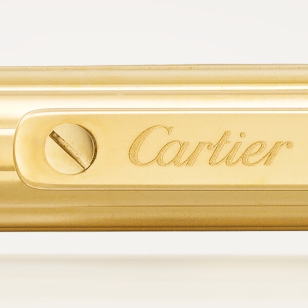 Santos de Cartier ballpoint pen Small model, engraved metal, gold finish