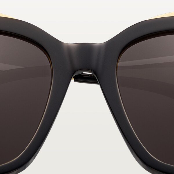 Panthère de Cartier sunglasses Combined black composite and smooth golden-finish metal, grey lenses.