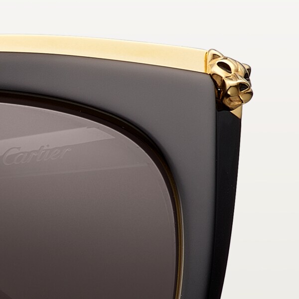 Panthère de Cartier sunglasses Combined black composite and smooth golden-finish metal, grey lenses.