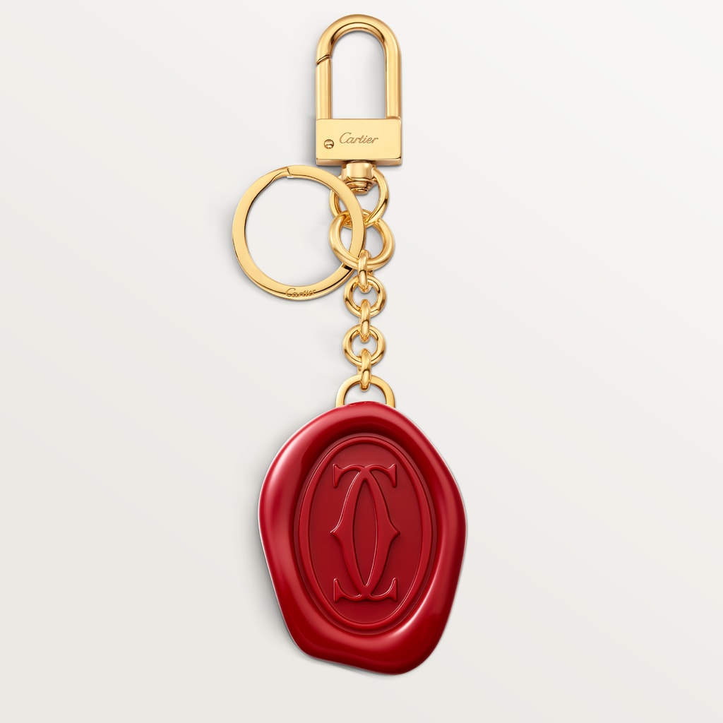 Diabolo de Cartier key ring with wax seal motifLacquered golden-finish metal