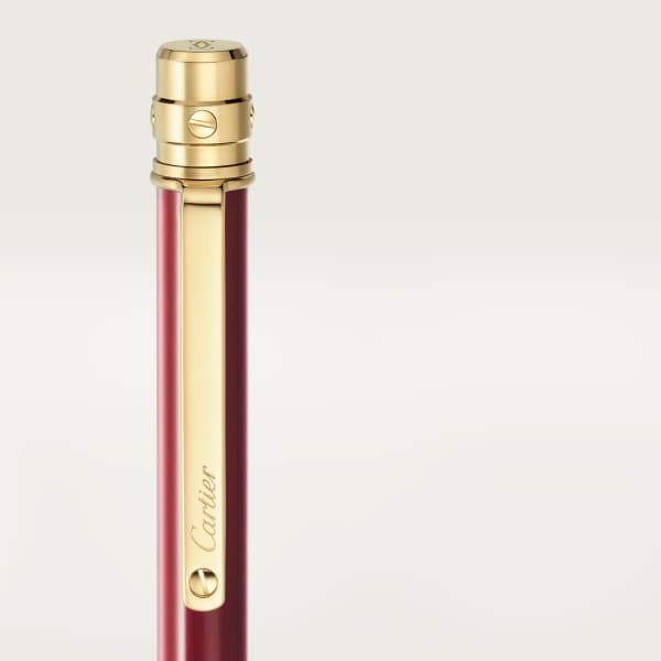 Santos de Cartier Kugelschreiber Kleines Modell, bordeauxroter Lack, Gold-Finish