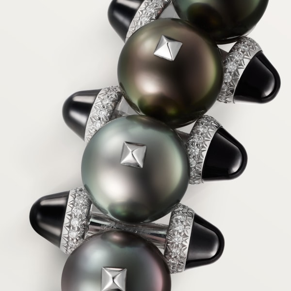 Broche Clash de Cartier Or gris rhodié, perles de Tahiti, onyx, diamants