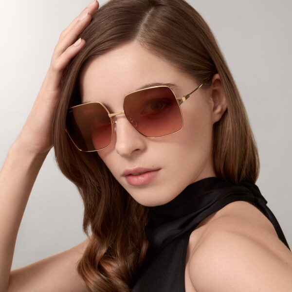 Santos de Cartier sunglasses Smooth and brushed golden-finish metal, graduated burgundy and apricot lenses with pink flash