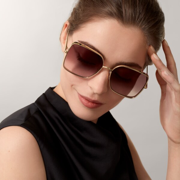 Panthère de Cartier sunglasses Smooth golden-finish metal, graduated burgundy lenses with rose gold-tone flash