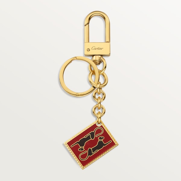 Diabolo de Cartier key ring with Panthère stamp motif Lacquered gold-finish metal