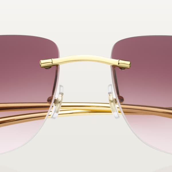 Lunettes Panthère de Cartier Solaires Métal, finition dorée lisse, verres pourpres