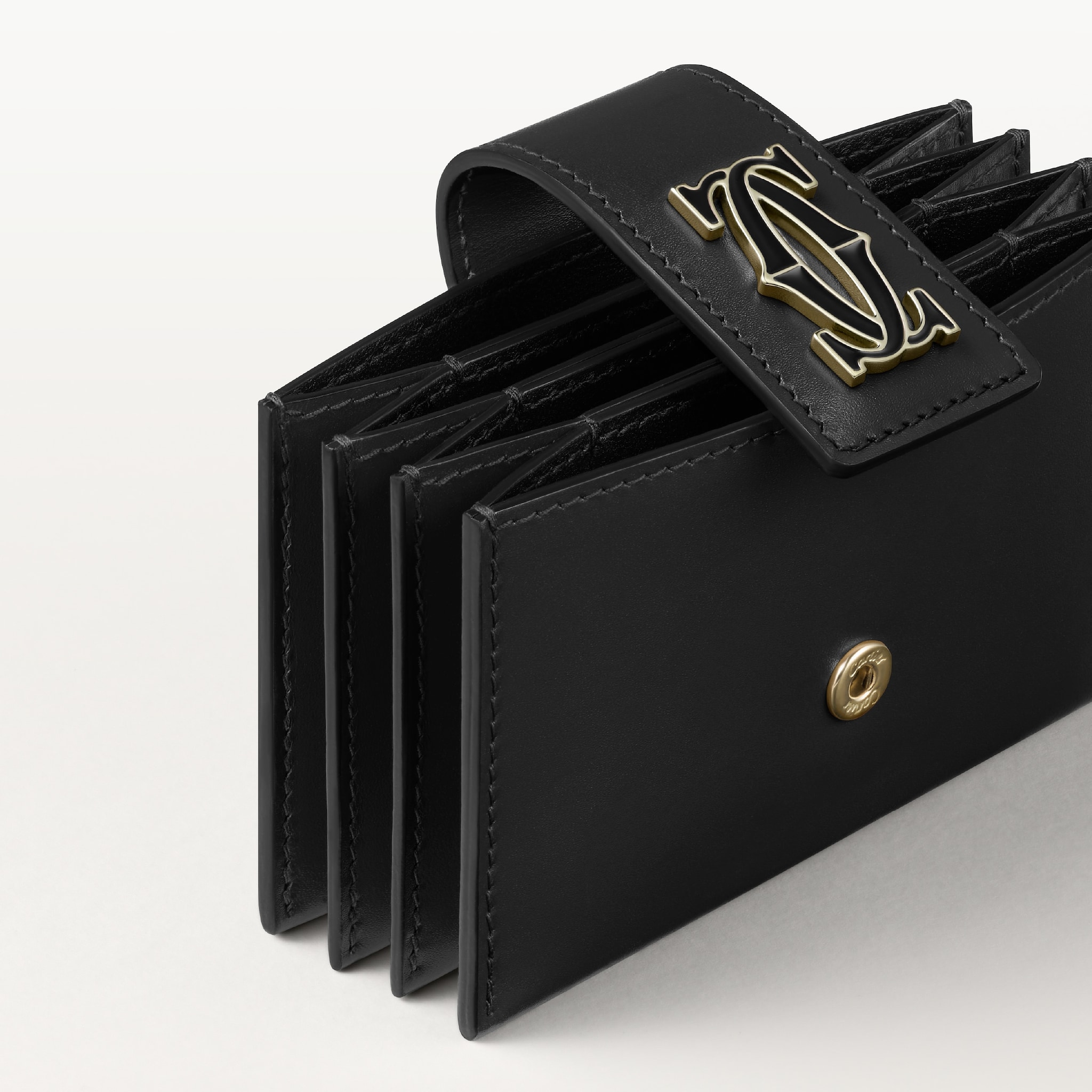 Accordion card holder, C de CartierBlack calfskin, golden finish and black enamel