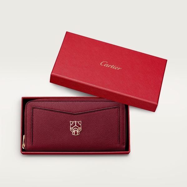 Zipped international wallet, Panthère de Cartier Burgundy grained calfskin, golden finish