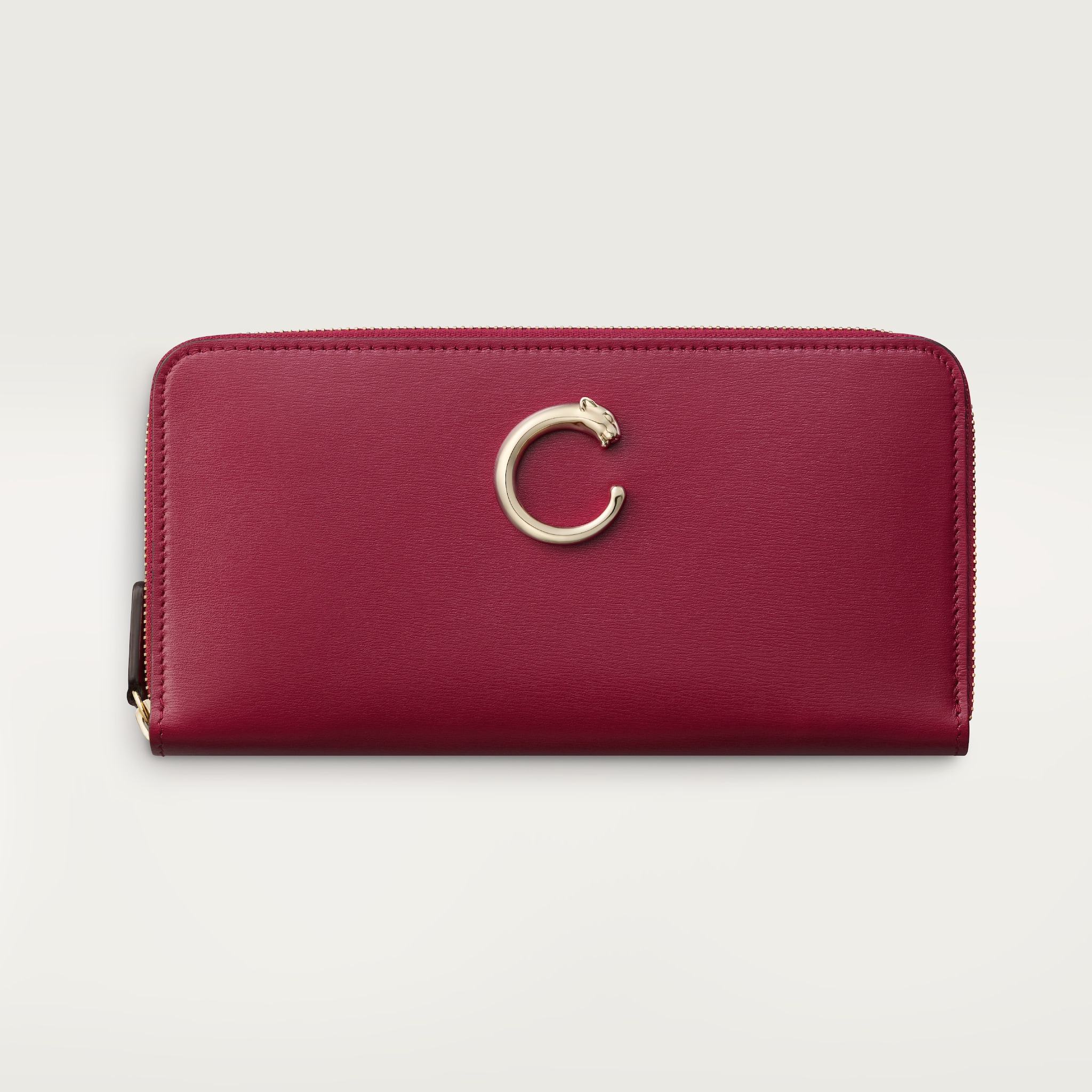 Cartera internacional con cremallera, Panthère de CartierPiel de becerro rojo cereza, acabado dorado