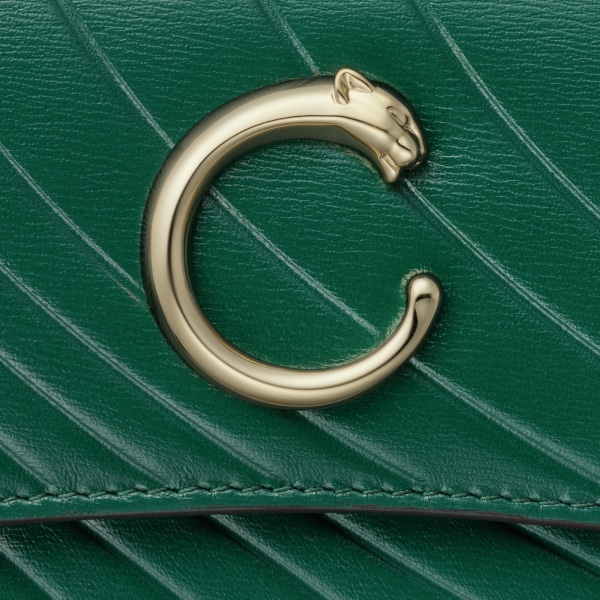 Cartera internacional con tapa, Panthère de Cartier Piel de becerro verde esmeralda, grabado con el motivo distintivo de Cartier, acabado dorado