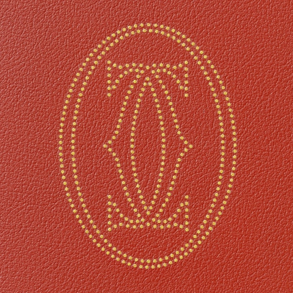 Pequeña marroquinería Must de Cartier, cartera compacta Piel de becerro dots lisse terracotta, acabado paladio