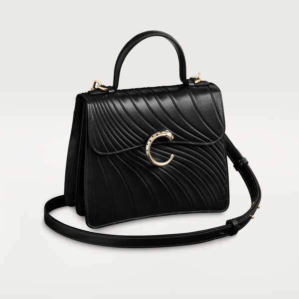 Handle bag small model, Panthère de Cartier Black calfskin, embossed Cartier signature motif, golden finish